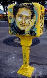 Vorschaubild Simone Veil<br>This street art was painted by C215. It's french painter. We can see this painting in Paris on many postbox in the Avenue de Choisy. There are a dozen of painting like this. C215 painted these dozen of painting in 2016. This painting represent Simone Veil. It's a famous woman in France because she did many importants things for women, and she had a difficult past.